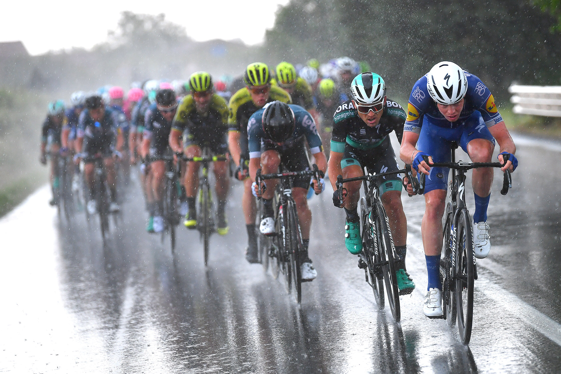 IMOLA, ITALY - MAY 17: Remi Cavagna of France and Team Quick-Step Floors / Rudiger Selig of Germany and Team Bora-Hansgrohe / Peloton / Rain / during the 101st Tour of Italy 2018, Stage 12 a 214km stage from Osimo to Imola-Autodromo Enzo e Dino Ferrari / Giro d'Italia / on May 17, 2018 in Imola, Italy. (Photo by Justin Setterfield/Getty Images)