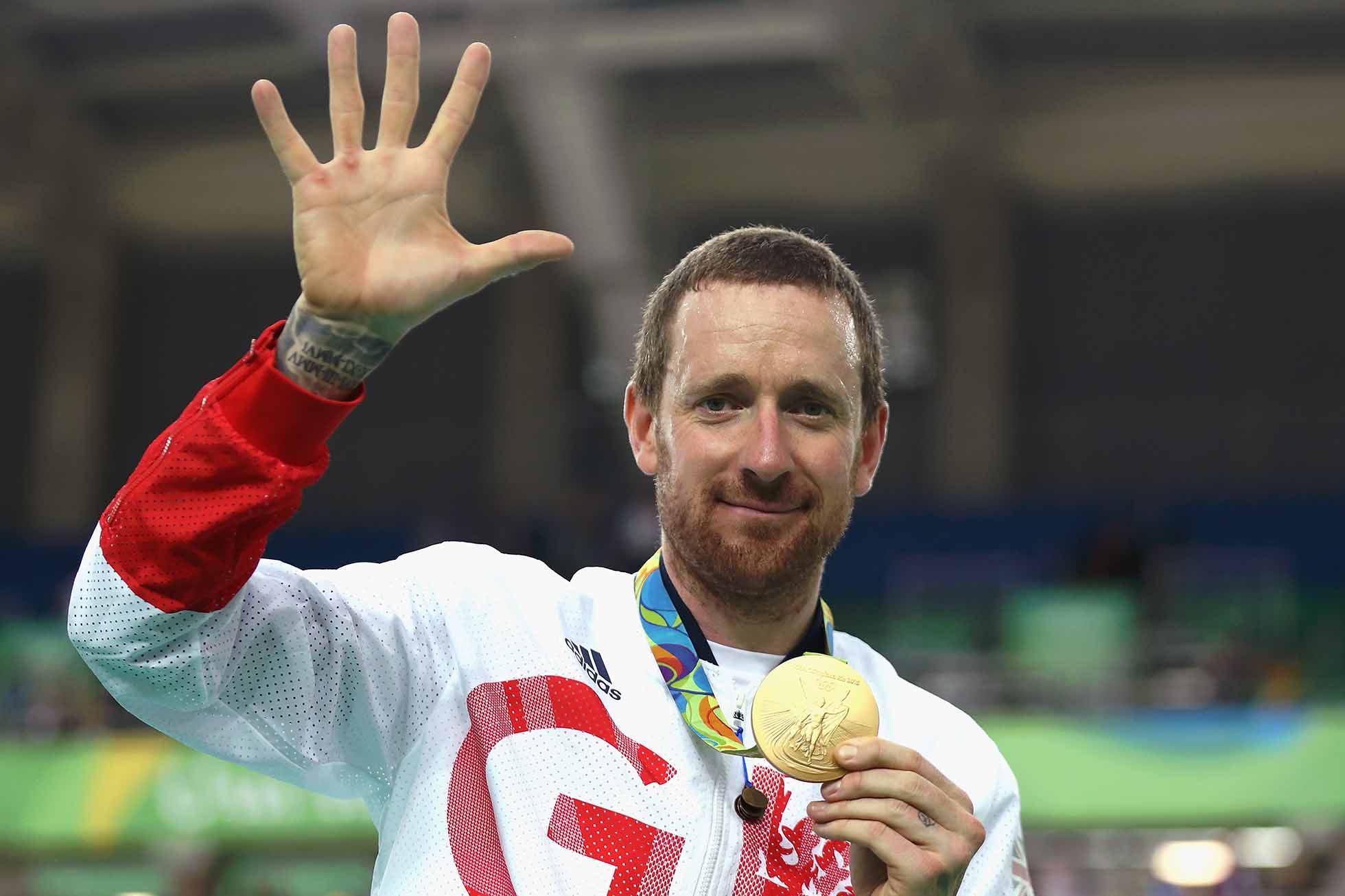 RIO DE JANEIRO, BRAZIL - AUGUST 12: Gold medalist Bradley Wiggins of Team Great Britain poses for photographs with his fifth gold medal in his career after at the medal ceremony for the Men's Team Pursuit on Day 7 of the Rio 2016 Olympic Games at the Rio Olympic Velodrome on August 12, 2016 in Rio de Janeiro, Brazil. (Photo by Bryn Lennon/Getty Images)