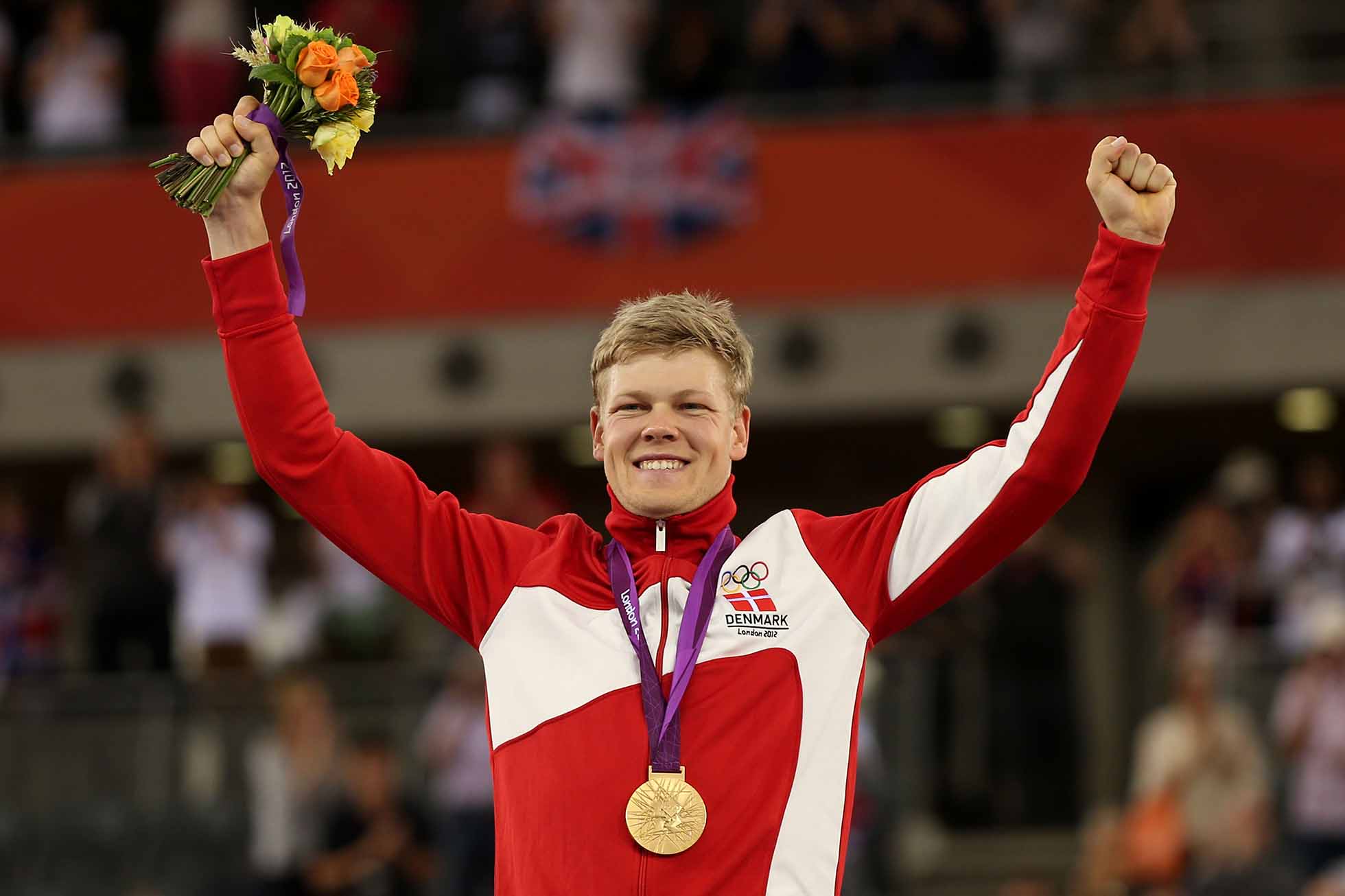 LONDON, ENGLAND - AUGUST 05: Lasse Norman Hansen of Denmark is presented the Gold medal during the medal ceremony for the Men's Omnium Track Cycling on Day 9 of the London 2012 Olympic Games at Velodrome on August 5, 2012 in London, England. (Photo by Bryn Lennon/Getty Images)