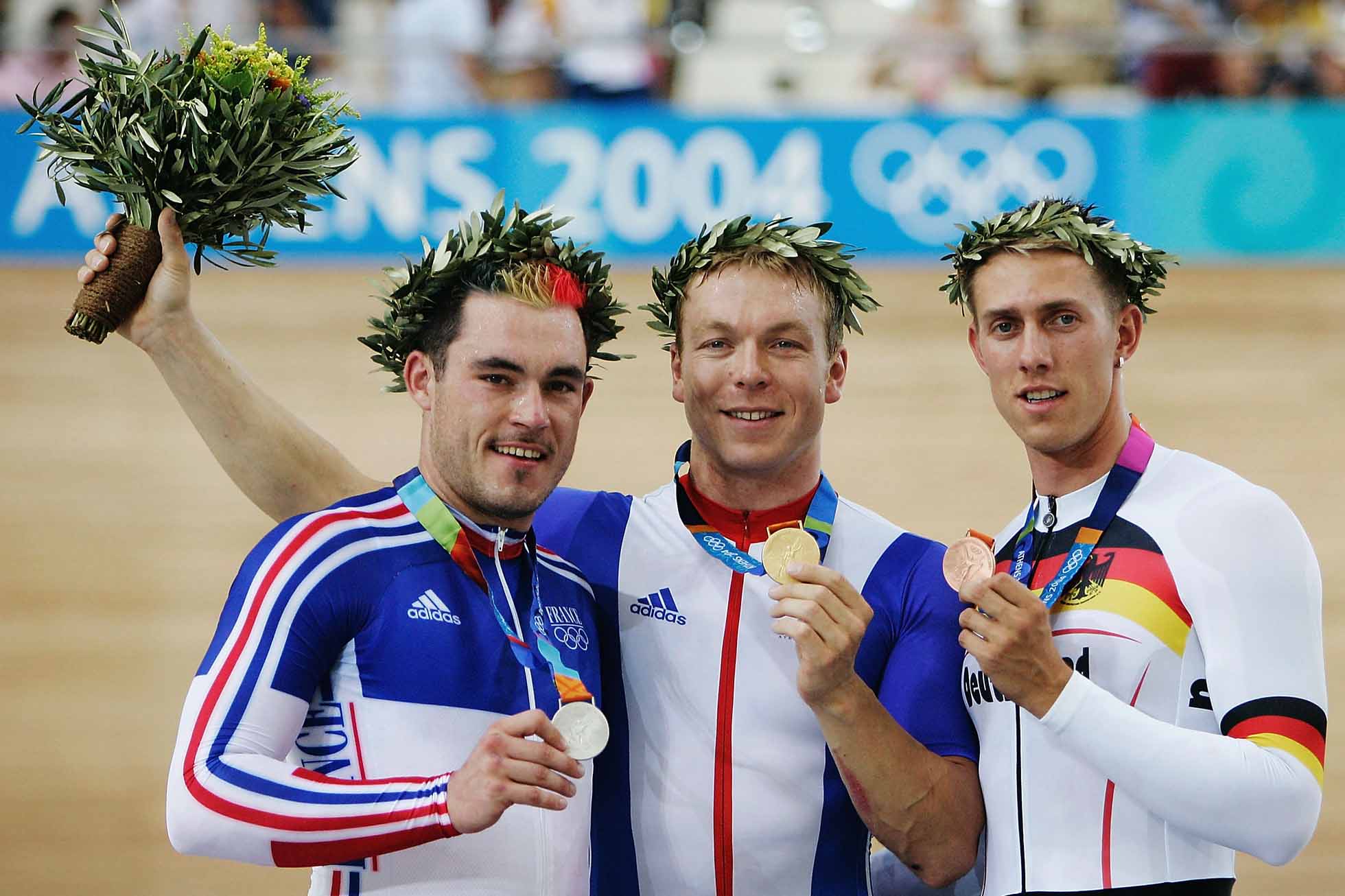 ATHENS - AUGUST 20: (L to R) Arnaud Tournant of France (silver), Chris Hoy of Great Britain (gold) and Stefan Nimke of Germany (bronze) hold up their medals after winning the men's track cycling 1 kilometre time trial final on August 20, 2004 during the Athens 2004 Summer Olympic Games at the Olympic Velodrome within the Olympic Sports Complex in Athens, Greece. (Photo by Donald Miralle/Getty Images)