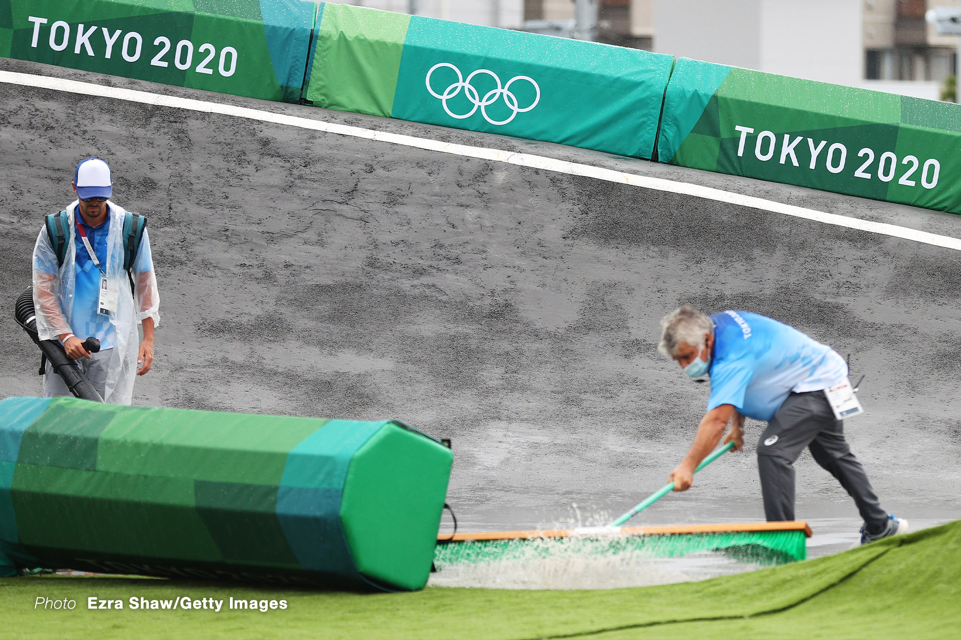 TOKYO, JAPAN - JULY 30: Members of staff are seen attending to the track after heavy rainfall prior to the Men's Semifinal race of the BMX Racing on day seven of the Tokyo 2020 Olympic Games at Ariake Urban Sports Park on July 30, 2021 in Tokyo, Japan. (Photo by Ezra Shaw/Getty Images)