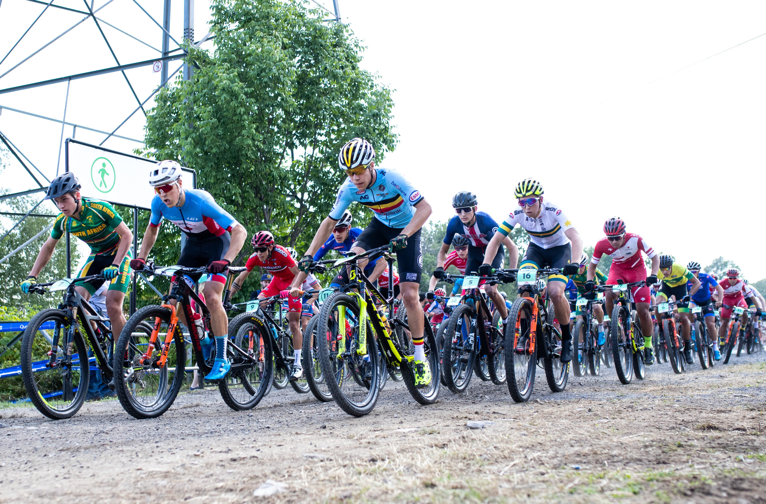 BEAUPRE, QC - AUGUST 29: Carter Woods of Canada, Lukas Malezsewski of Belgium, Corey Smith of Australia compete during the men's Junior Cross-country Olympic distance race at the UCI Mountain Bike World Championships at Mont-Sainte-Anne on August 29, 2019 in Beaupre, Canada. (Photo by Dustin Satloff/Getty Images)