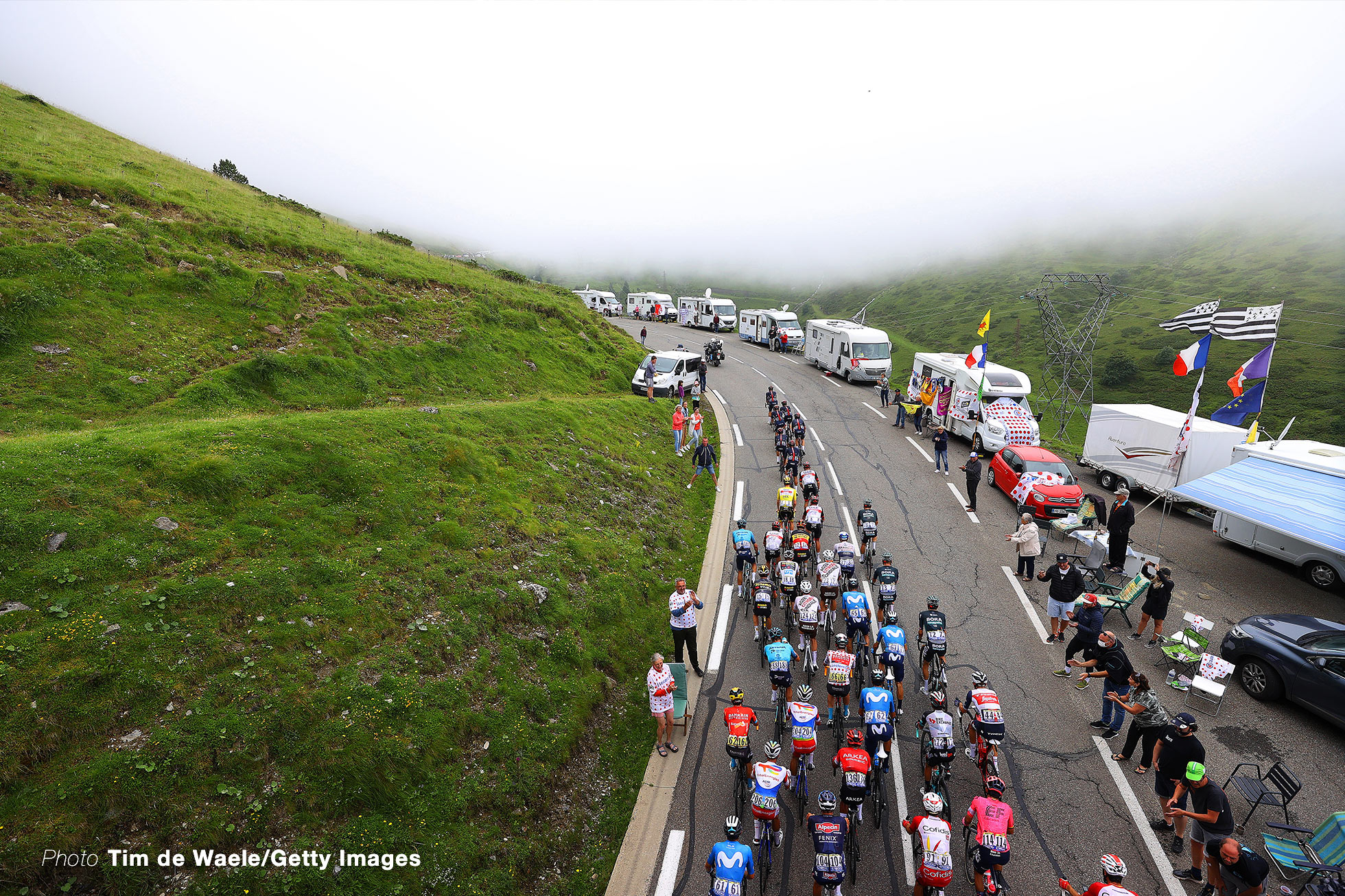 LUZ ARDIDEN, FRANCE - JULY 15: Dylan Van Baarle of The Netherlands and Team INEOS Grenadiers, Tadej Pogačar of Slovenia and UAE-Team Emirates Yellow Leader Jersey, Jonas Vingegaard of Denmark and Team Jumbo-Visma White Best Young Rider Jersey, Wout Poels of The Netherlands and Team Bahrain - Victorious Polka Dot Mountain Jersey & The Peloton at Col du Tourmalet (2115m) during the 108th Tour de France 2021, Stage 18 a 129,7km stage from Pau to Luz Ardiden 1715m / Fans / Public / @LeTour / #TDF2021 / on July 15, 2021 in Luz Ardiden, France. (Photo by Tim de Waele/Getty Images)