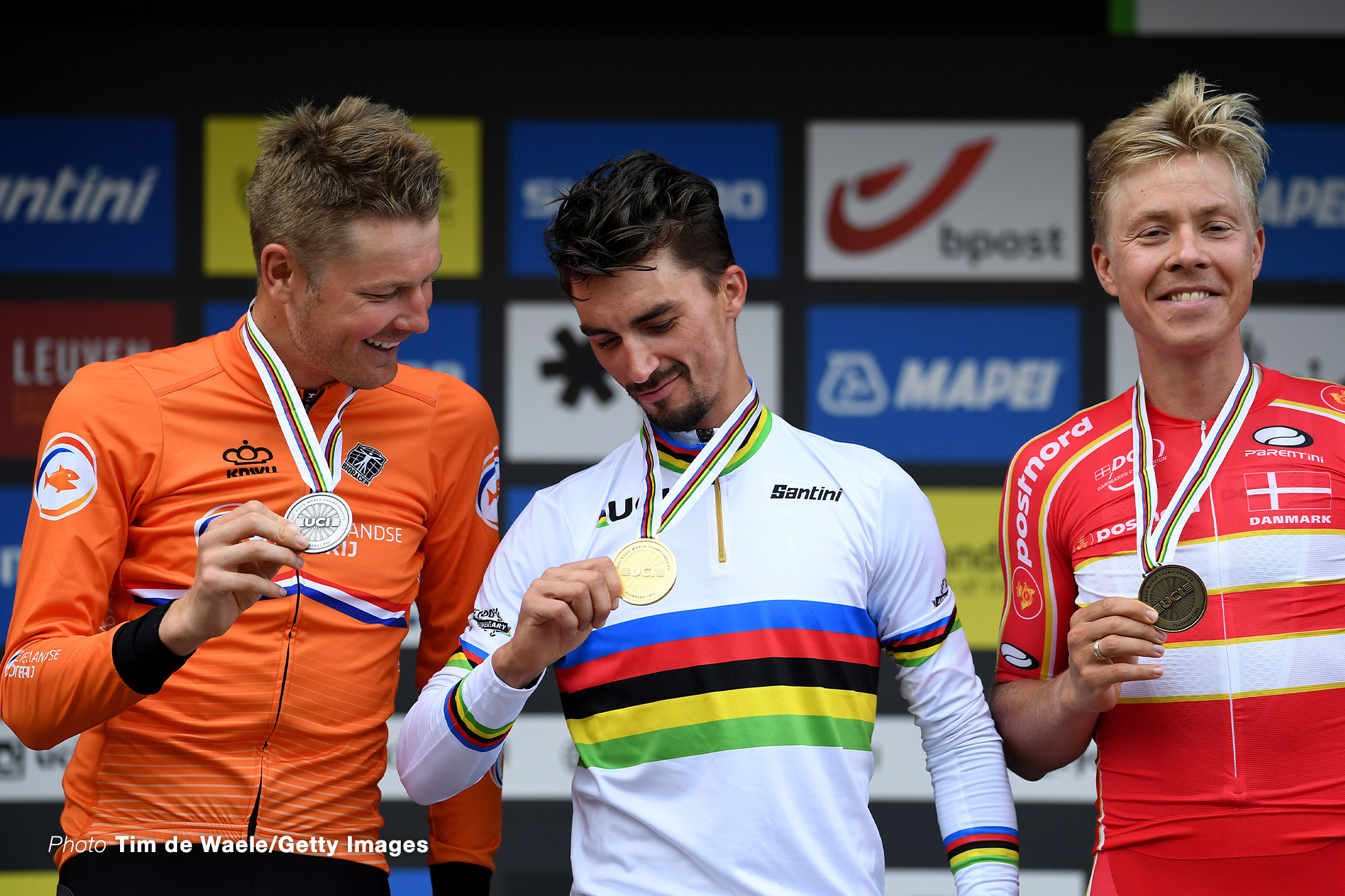 LEUVEN, BELGIUM - SEPTEMBER 26: (L-R) Silver medalist Dylan Van Baarle of The Netherlands, gold medalist Julian Alaphilippe of France and bronze medalist Michael Valgren Hundahl of Denmark pose on the podium during the medal ceremony after the 94th UCI Road World Championships 2021 - Men Elite Road Race a 268,3km race from Antwerp to Leuven / #flanders2021 / on September 26, 2021 in Leuven, Belgium. (Photo by Tim de Waele/Getty Images)