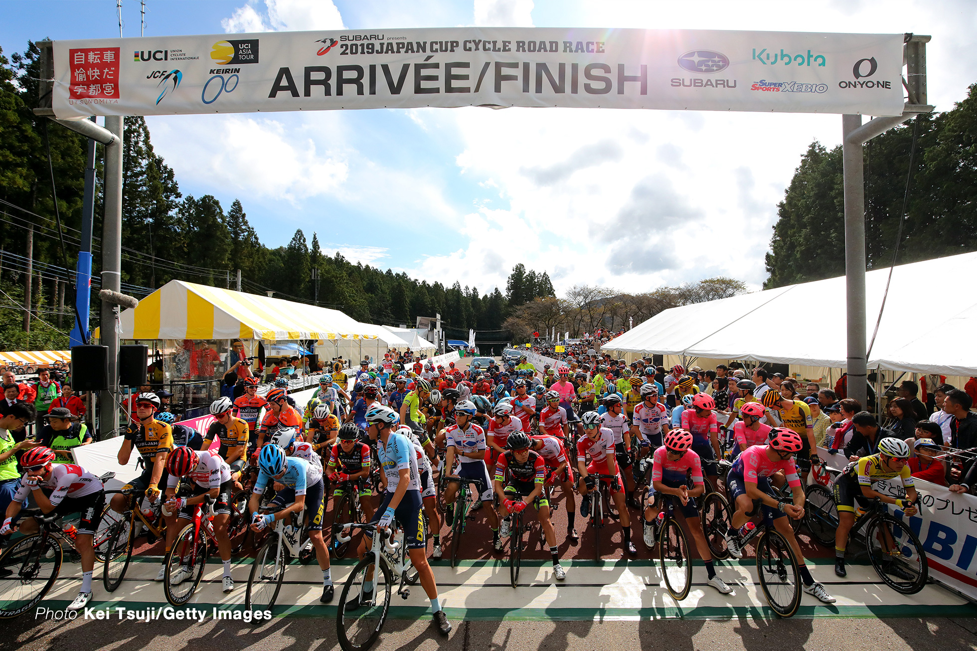 UTSUNOMIYA, JAPAN - OCTOBER 20: Start / Julien Bernard of France and Team Trek-Segafredo / Bauke Mollema of Netherlands and Team Trek-Segafredo / Brenton Jones of Australia and Team Delko Marseille Provence / Alexandre Delettre of France and Team Delko Marseille Provence / David Morton Lachlan of Australia and Team EF Education First / Michael Woods of Canada and Team EF Education First / Taylor Phinney of United States and Team EF Education First / Nathan Brown of United States and Team EF Education First / Peloton / Public / Fans / during the 28th Japan Cup 2019, Cycle Road Race a 144,2km race from Utsunomiya to Utsunomiya / @Japancup_ofc / on October 20, 2019 in Utsunomiya, Japan. (Photo by Kei Tsuji/Getty Images)