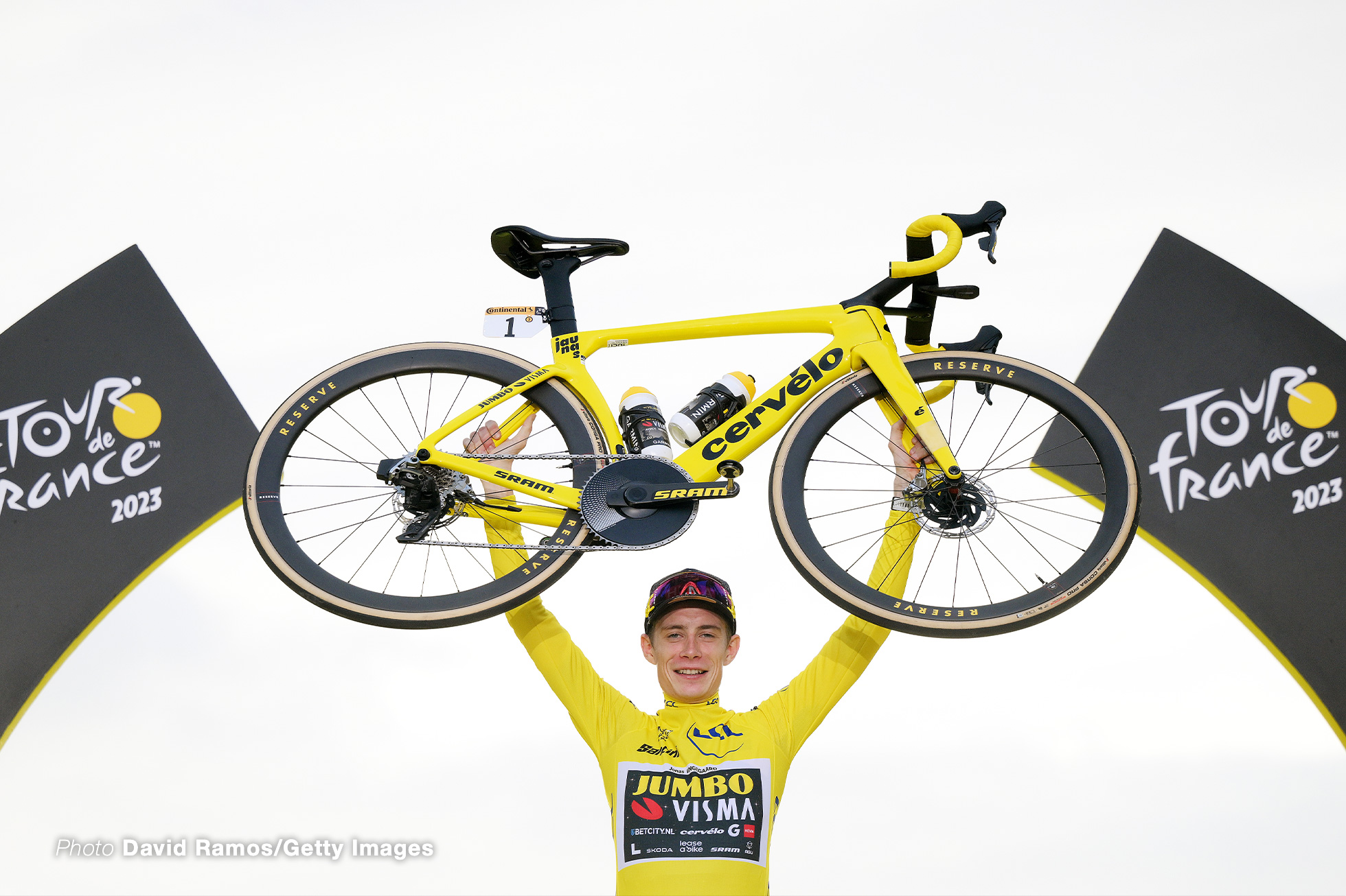 PARIS, FRANCE - JULY 23: Jonas Vingegaard of Denmark and Team Jumbo-Visma - Yellow Leader Jersey celebrates at podium as final overall winner with a custom yellow Cervélo bike during the stage twenty-one of the 110th Tour de France 2023 a 11 5.1km stage from Saint-Quentin-en-Yvelines to Paris / #UCIWT / on July 23, 2023 in Paris, France. (Photo by David Ramos/Getty Images)