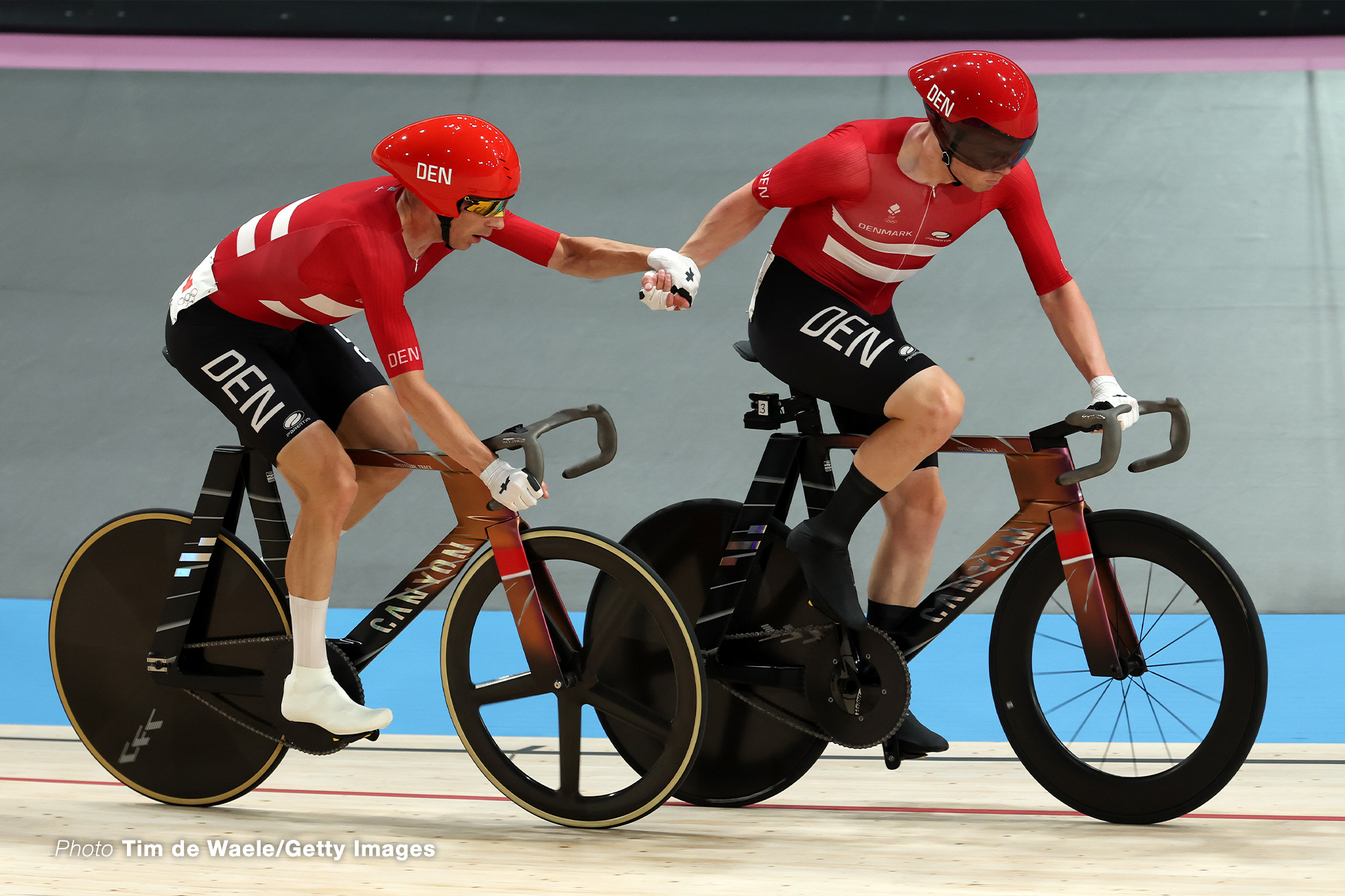 PARIS, FRANCE - AUGUST 10: Niklas Larsen and Michael Moerkoev of Team Denmark take over during the Men's Madison Final on day fifteen of the Olympic Games Paris 2024 at Saint-Quentin-en-Yvelines Velodrome on August 10, 2024 in Paris, France. (Photo by Tim de Waele/Getty Images)