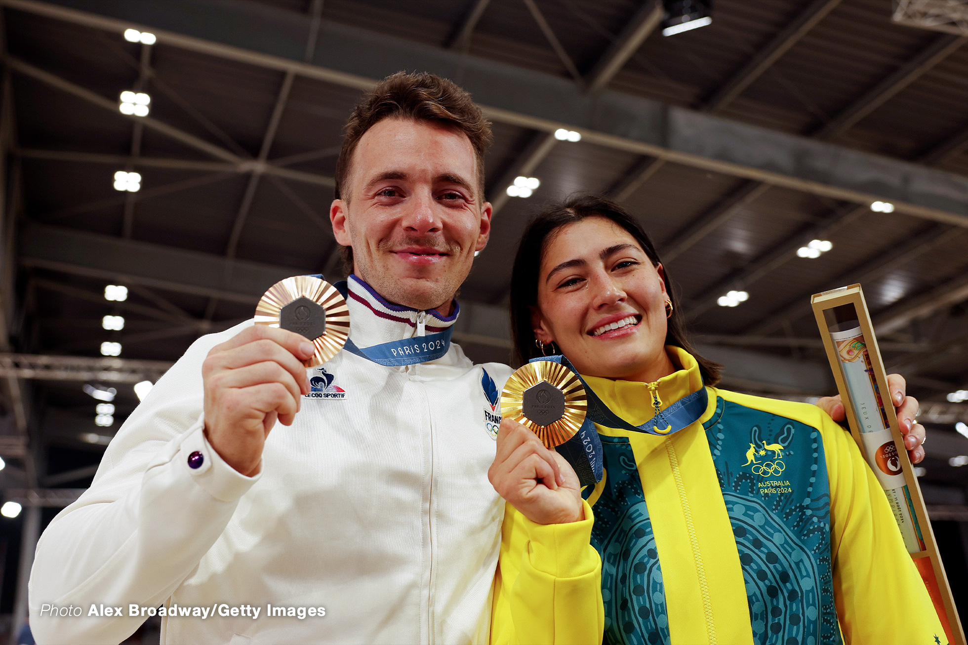 PARIS, FRANCE - AUGUST 02: Bronze medalists Romain Mahieu of Team France and Gold medalists Saya Sakakibara of Team Australia pose for a photograph on the podium during the Women's Final on day seven of the Olympic Games Paris 2024 at Saint-Quentin-en-Yvelines BMX Stadium on August 02, 2024 in Paris, France. (Photo by Alex Broadway/Getty Images)