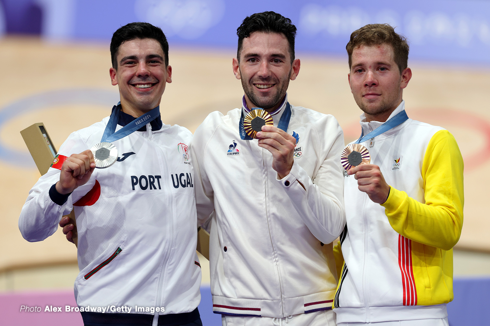 PARIS, FRANCE - AUGUST 08: Gold medalist Benjamin Thomas of Team France (C), Silver medalist Iuri Leitao of Team Portugal (L) and Bronze medalist Fabio van den Bossche of Team Belgium (R) pose on the podium after the Men's Omnium Points Race 4/4 on day thirteen of the Olympic Games Paris 2024 at Saint-Quentin-en-Yvelines Velodrome on August 08, 2024 in Paris, France. (Photo by Alex Broadway/Getty Images)