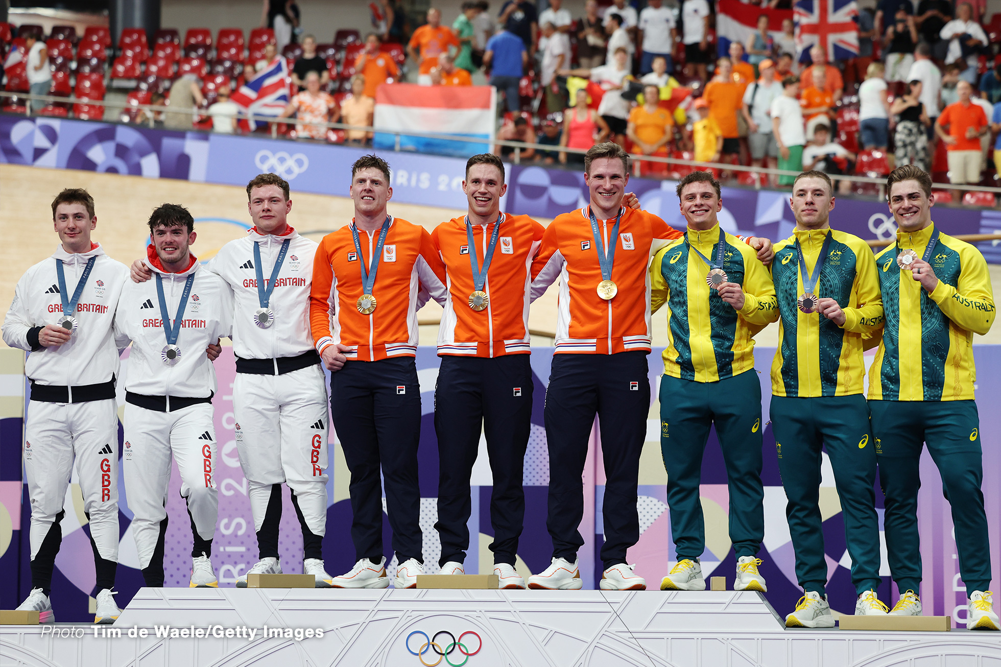 PARIS, FRANCE - AUGUST 06: Silver medalists Ed Lowe, Hamish Turnbull, Jack Carlin of Team Great Britain, Gold medalists Jeffrey Hoogland, Harrie Lavreysen, Roy van den Berg of Team Netherlands, Bronze medalists Matthew Glaetzer, Leigh Hoffman, Matthew Richardson of Team Australia pose on the podium after the Men's Team Sprint - Finals on day eleven of the Olympic Games Paris 2024 at Saint-Quentin-en-Yvelines Velodrome on August 06, 2024 in Paris, France. (Photo by Tim de Waele/Getty Images)