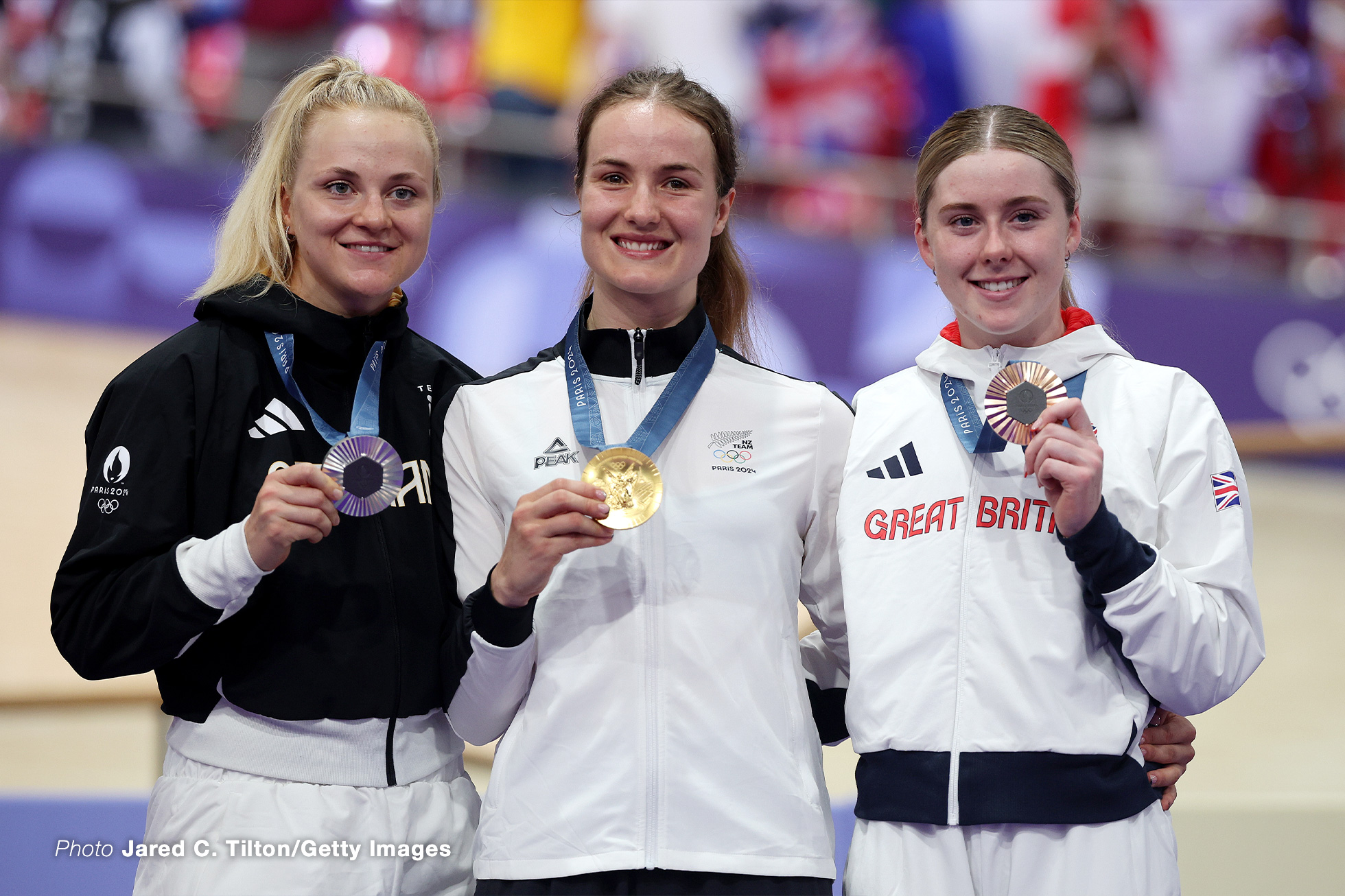 PARIS, FRANCE - AUGUST 11: Gold medalist Ellesse Andrews of Team New Zealand (C), Silver medalist Lea Friedrich of Team Germany (L) and Bronze medalist Emma Finucane of Team Great Britain (R) pose on the podium after the Women's Sprint, Finals on day sixteen of the Olympic Games Paris 2024 at Saint-Quentin-en-Yvelines Velodrome on August 11, 2024 in Paris, France. (Photo by Jared C. Tilton/Getty Images)