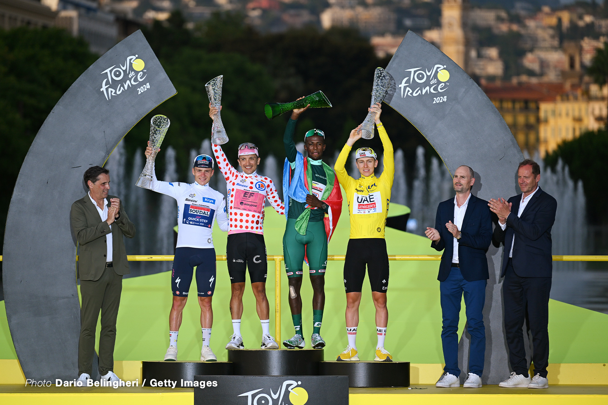 NICE, FRANCE - JULY 21: (L-R) Remco Evenepoel of Belgium and Team Soudal Quick-Step - White Best Young Rider Jersey, Richard Carapaz of Ecuador and Team EF Education - EasyPost - Polka Dot Mountain Jersey, Biniam Girmay of Eritrea and Team Intermarche - Wanty - Green Sprint Jersey and Tadej Pogacar of Slovenia and UAE Team Emirates - Yellow Leader Jersey with the presence of : Christian Prudhomme of France (R) Director of Le Tour de France celebrate at final podium during the 111th Tour de France 2024, Stage 21 a 33.7km individual time trial from Monaco to Nice / #UCIWT / on July 21, 2024 in Nice, France.